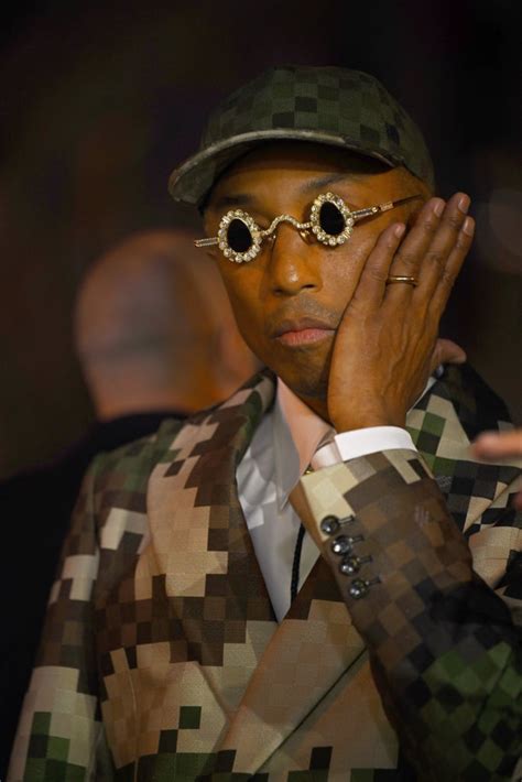 Pharrell Williams's Diamond Sunglasses at Louis .